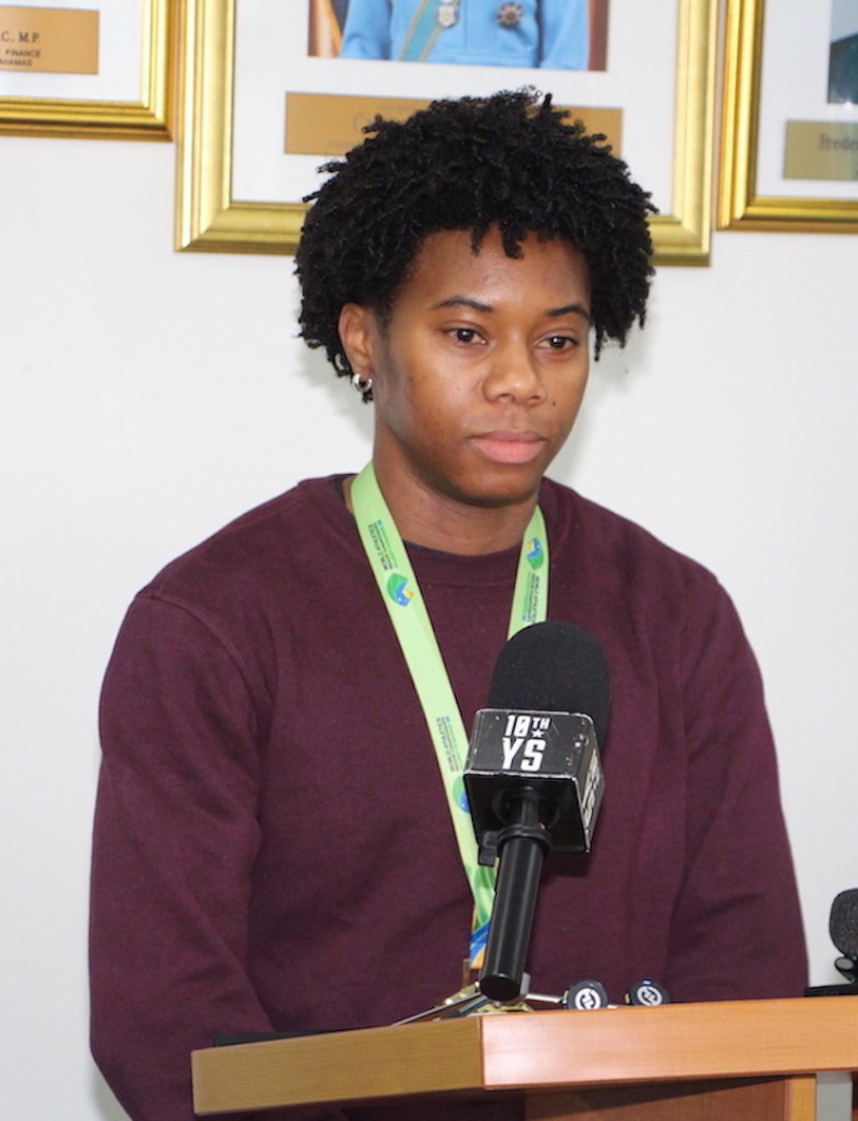 Star Athlete Devynne Charlton greeted by Minister Mario Bowleg upon arrival home